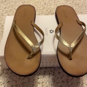 Beach gold sandals.